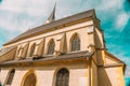 Church of St. Leonard in Austria on a bright blue sky background.Christian and catholic faith. Bottom view . Royalty Free Stock Photo