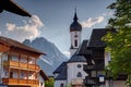 Church and houses of Garmisch with Zugspitze peak in Bavaria Royalty Free Stock Photo