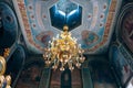 Church of St. Nicholas, large gold or bronze chandelier in the temple or cathedral