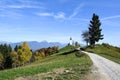 The church of St. Primoz in Slovenia near Jamnik with colorful autumn trees and blue sky, Slovenia Royalty Free Stock Photo