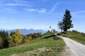 The church of St. Primoz in Slovenia near Jamnik with colorful autumn trees and blue sky Royalty Free Stock Photo