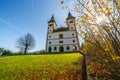 Church of St. Volbenka in autumn colors against a blue sky, Slovenia, Europe