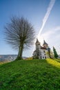 Church of St. Volbenka in autumn colors against a blue sky, Slovenia, Europe