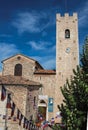 Church, steeple with clock and flags in Vence.