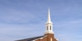 Church steeple with cloudy blue sky background Royalty Free Stock Photo