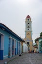 Church steeple on colorific street of Trinidad, Cuba Royalty Free Stock Photo