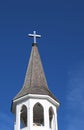 Church steeple roof with shiny metal cross Royalty Free Stock Photo