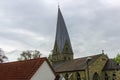 a church with a steeple stands near the street signs Royalty Free Stock Photo