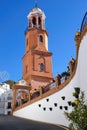 Church and street of Competa village. Beautiful typical spanish colonial architecture, Andalusia, Spain