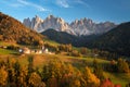 Autumn landscape with church and Dolomites mountains Royalty Free Stock Photo