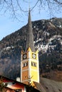 Church tower in Alpine village Bad Hofgastein , Austria. Royalty Free Stock Photo