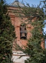 Church tower with bell in the village