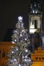 Church tower and christmas tre in prague Royalty Free Stock Photo