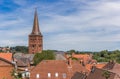Church tower and cityscape of Plon