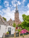 Church tower and part of wooden house in historic old town of Br