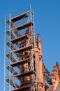 Church tower renovation against a blue sky Royalty Free Stock Photo