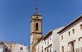 Church tower and white houses at the central square of Requena