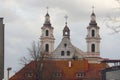 Church towers over roof in Vilnius city