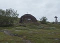 Church at traditonal saami style at Staloluokta sami village at Virihaure lake. Summer moody and foggy day at