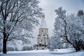 Church view through the trees in winter snowfall. The Church of the ascension in Kolomenskoye. Moscow, Russia Royalty Free Stock Photo