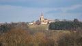 Church in village Hosin with dramatic sky, Czech landscape