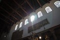 Church walls from the inside. Sunlight passes through the windows of the religious building, illuminating the room.