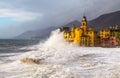 The Church and the wave in Camogli, Genoa, Italy Royalty Free Stock Photo