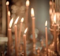 Church. Wax candles. Lighted candles in the church