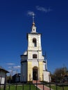 The church is white with a path of pink stone. The top of the church touched the obliquity in the sky. Around the green grass. Royalty Free Stock Photo