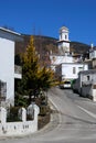 Church in white village, Pitres, Spain. Royalty Free Stock Photo