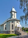 Church with white walls with windows of different shapes and a s Royalty Free Stock Photo