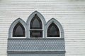 Church Window with Stained Glass and Decorative Gables Royalty Free Stock Photo