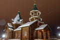 Church in winter with lights and snow in the night. Norilsk Talnakh