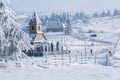 Church Winter rural landscape in a mountain village in Transylvania, Romania Royalty Free Stock Photo