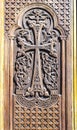 Church wooden door with carved cross assembled of folk floral pattern Royalty Free Stock Photo