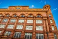 Churchgate House or Tootal Broadhurst and Lee building facade in Manchester, dated 1896, set against the blue sky