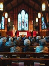 Churchgoers gather for a service, their attention directed towards the altar where warm light filters through stained Royalty Free Stock Photo