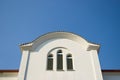 White church window against blue sky Royalty Free Stock Photo