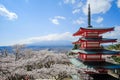 Chureito red Pagoda with beautiful Cherry Blossom or pink Sakura flower tree and Mount Fuji against blue sky. Spring Season at Royalty Free Stock Photo