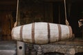 Churn is a barrel hanging on two ropes and designed for whipping milk into a more fatty product Royalty Free Stock Photo