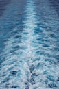 The churning and bubbling wake pattern of a cruise ship