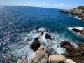 Churning ocean waves crashing against a rocky shoreline Royalty Free Stock Photo