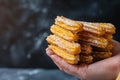 Churro Sticks in Hand, Churros Pastry, Fried Spanish Dessert, Churro Sticks Closeup, Copy Space