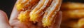 Churro Sticks in Hand, Churros Pastry, Fried Spanish Dessert, Churro Sticks Closeup, Copy Space