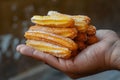 Churro Sticks in Hand, Churros Pastry, Fried Spanish Dessert, Churro Sticks Closeup, Copy Space