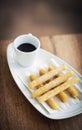 Churros and chocolate spanish donuts with sauce breakfast snack Royalty Free Stock Photo