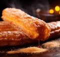 Churros with cinnamon and sugar on a black background, AI