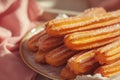 Churros with cinnamon and sugar. Generative AI