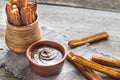 Churros - famous Spanish dessert with chocolate sauce Royalty Free Stock Photo