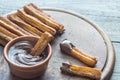 Churros - famous Spanish dessert with chocolate sauce Royalty Free Stock Photo